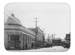 B street looking toward depot, photo circa 1915 Street scene looking toward the depot from B street and First. First National Bank, built in 1911, and the Opera house on the left with Oscar C. Schulze's previously Eppinger's on the right.